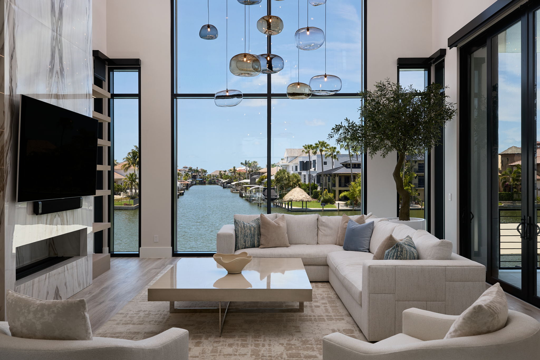 ES Homes living room with expansive water views